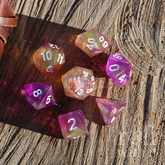 Set of colorful polyhedral dice on a wooden surface