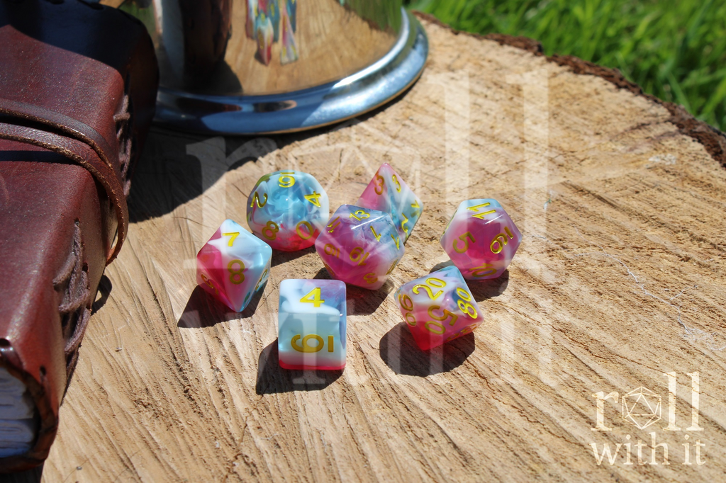 Set of 7 pink, light blue and white swirling DnD role playing dice