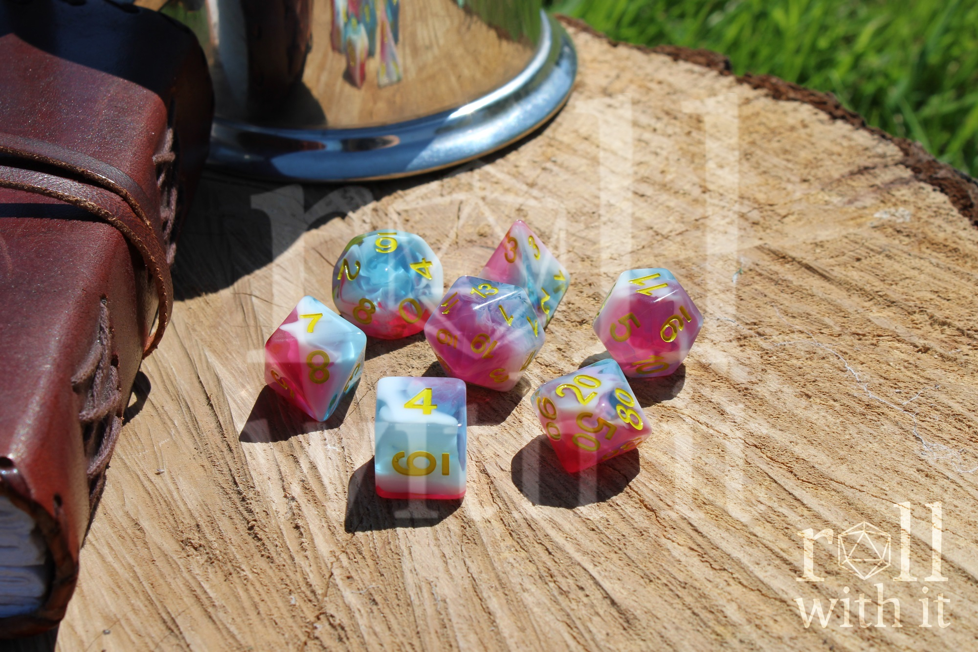 Set of 7 pink, light blue and white swirling DnD role playing dice