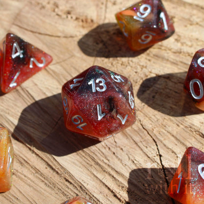 Set of glittery burnt orange polyhedral dice with silver numbers, sat on a wooden oak base.