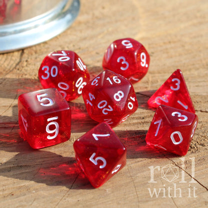 7 red dice with white numbers on a wooden surface, featuring the 'roll with it' logo.