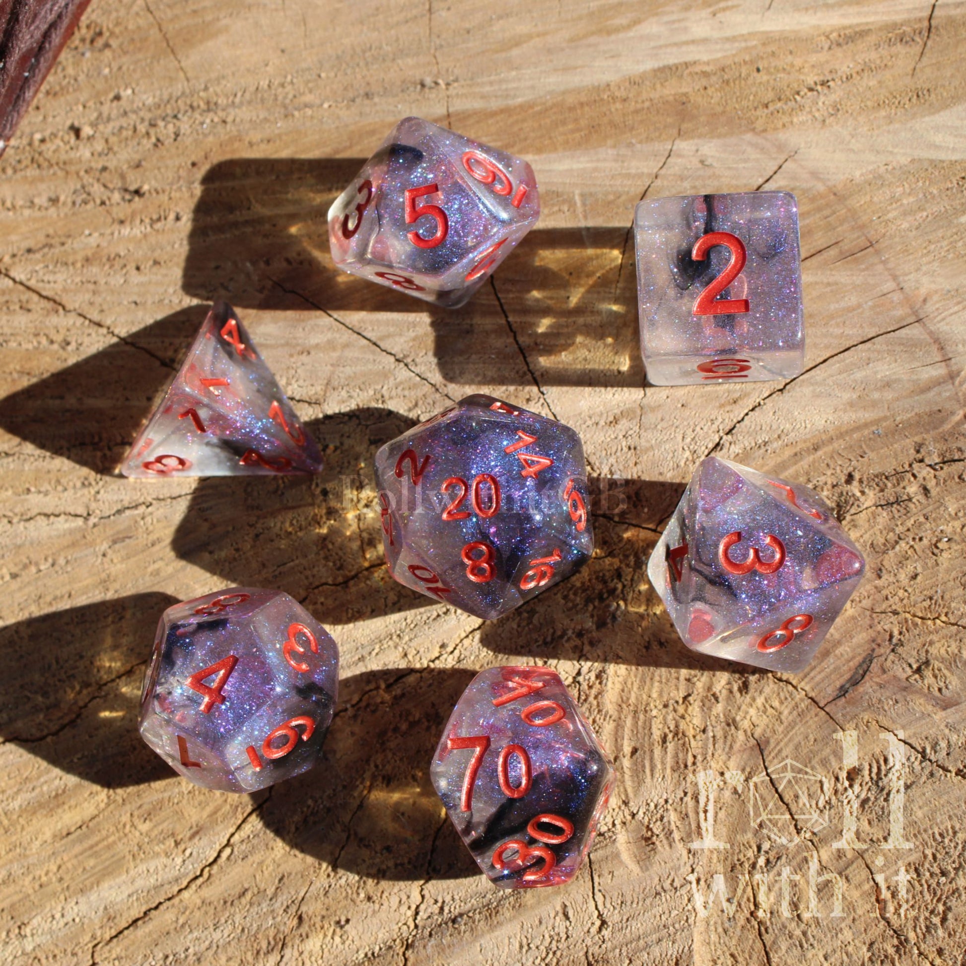Set of 7 purple dark goth aesthetic polyhedral D&D dice with red numbers on a wooden surface