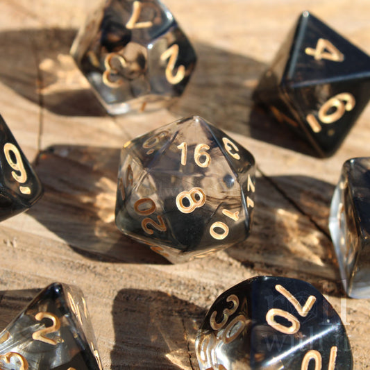 Black Smoking Gothic DnD dice set on a wooden background