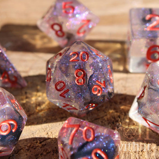7 transparent starry glittery galaxy purple and black roleplaying dice with red numbers on a wooden surface