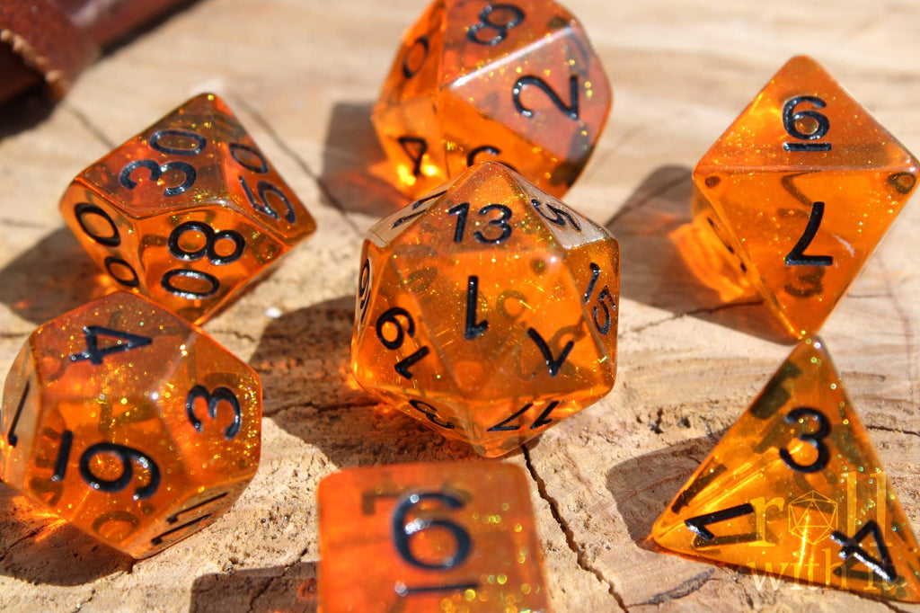 Tangerine Orange 7 polyhedral dice set on a wooden surface