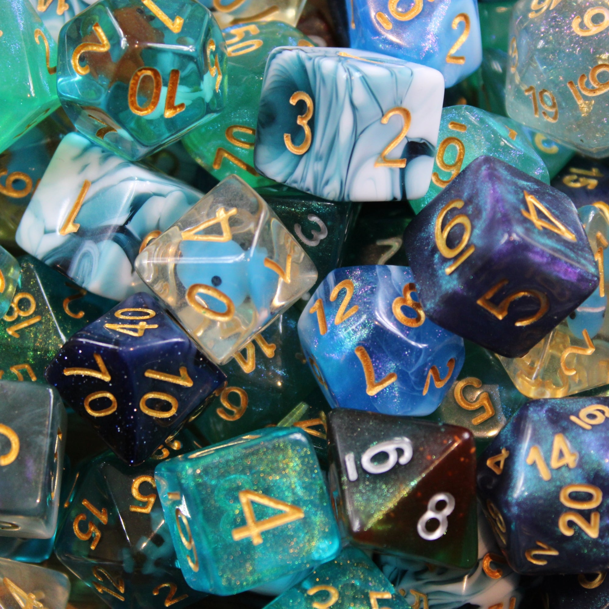 Assorted polyhedral roleplaying dice in various shades of blue with numbers on a dark background