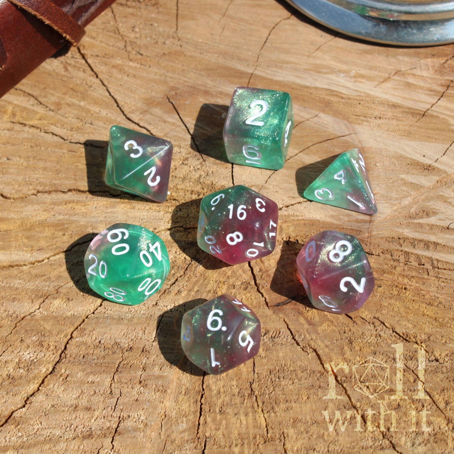 Set of colorful polyhedral dice on a wooden surface with white numbers
