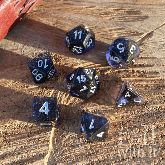 Set of dark space themed dnd polyhedral dice on a wooden surface