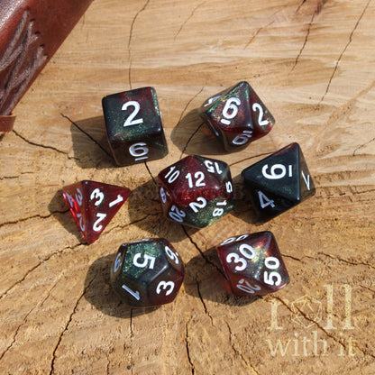 Set of polyhedral dice on a wooden surface