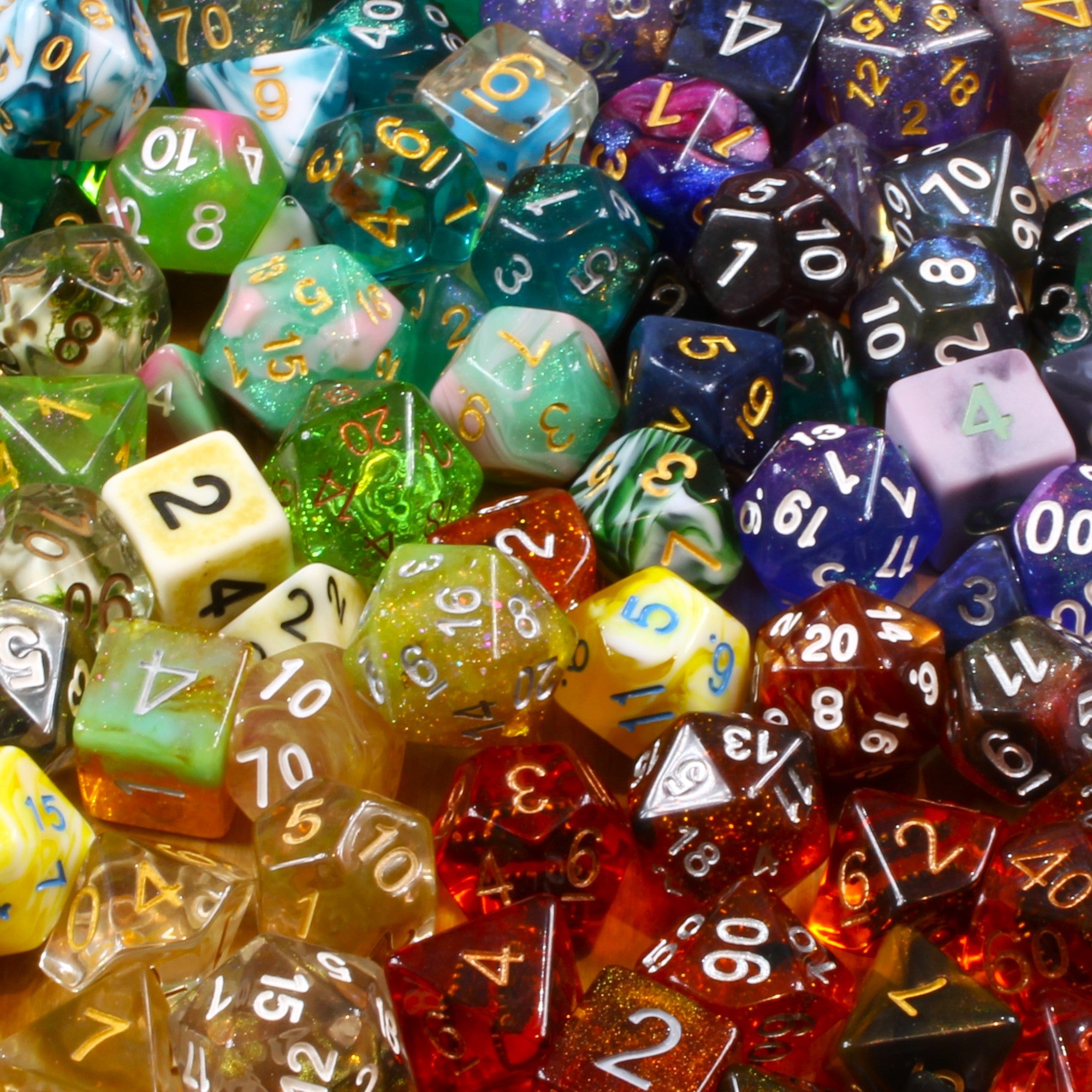 Assorted colourful polyhedral DnD roleplaying dice with numbers on a multicoloured background
